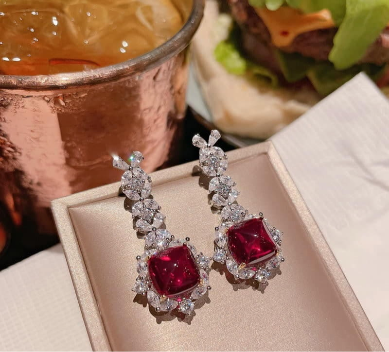 Ruby Zircon Square Drop Earrings Pair on display