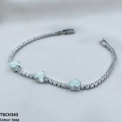 Detailed view of zircon square design on bracelet. 