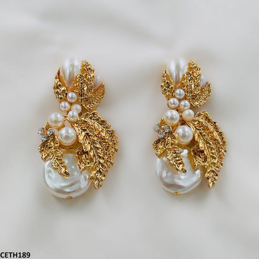 Golden Big Pearl Luxury Earrings close-up  