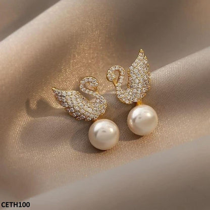 Playful and elegant duck pearl earrings