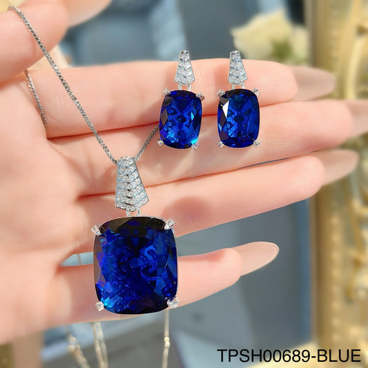 Stylish zircon crystal pendant and ear top set in silver.
